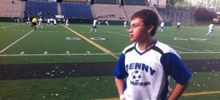 boys soccer player on the sidelines